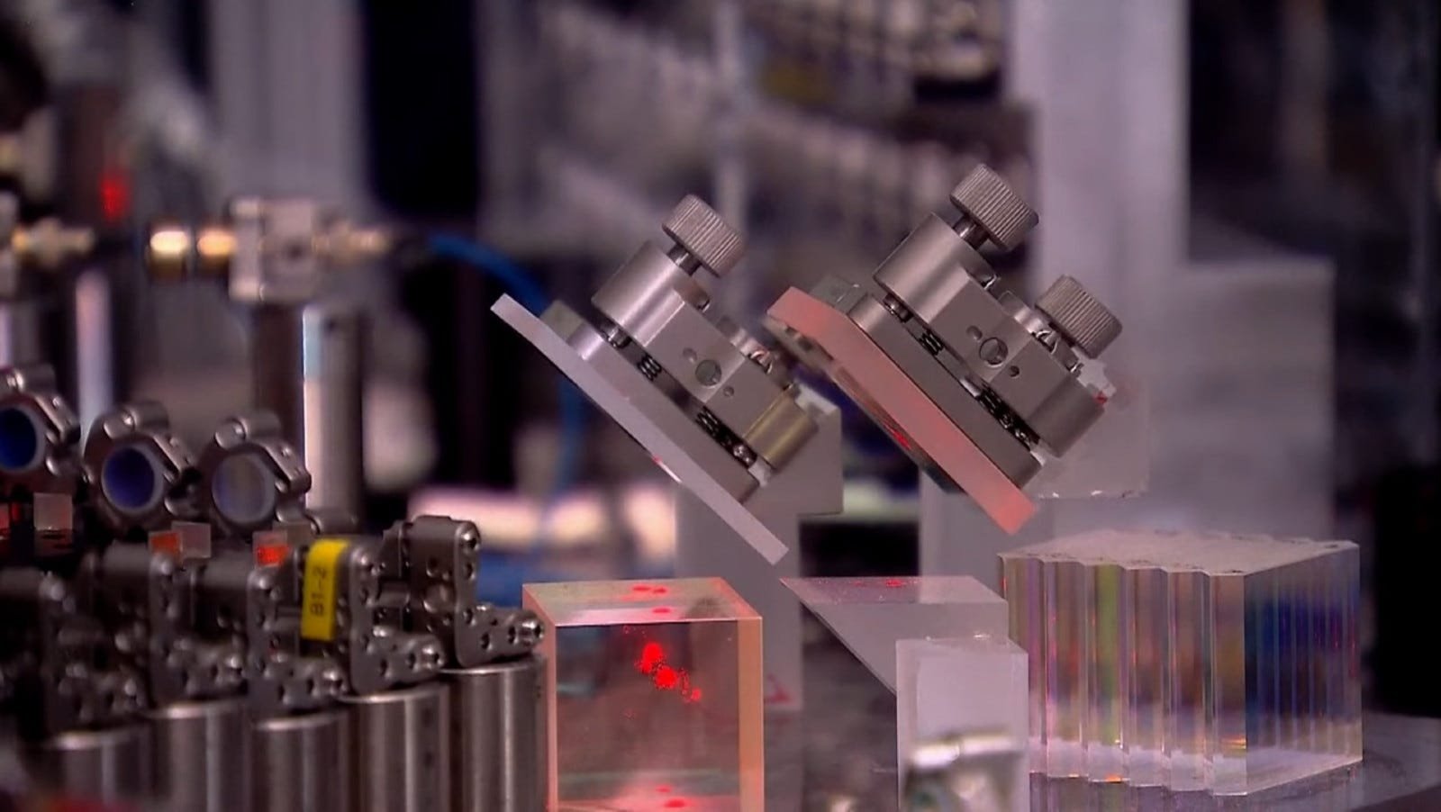 Complex optical layout of China’s Jiuzhang 3 quantum computer with glowing red lasers and photonic components