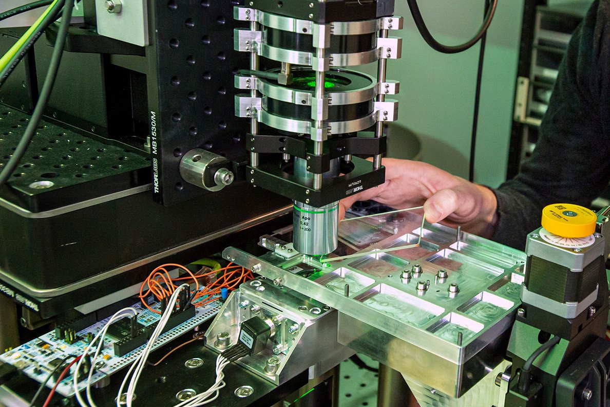 Close-up of Microsoft Project Silica’s femtosecond laser system writing data onto a quartz glass plate for ultra-long-term storage.